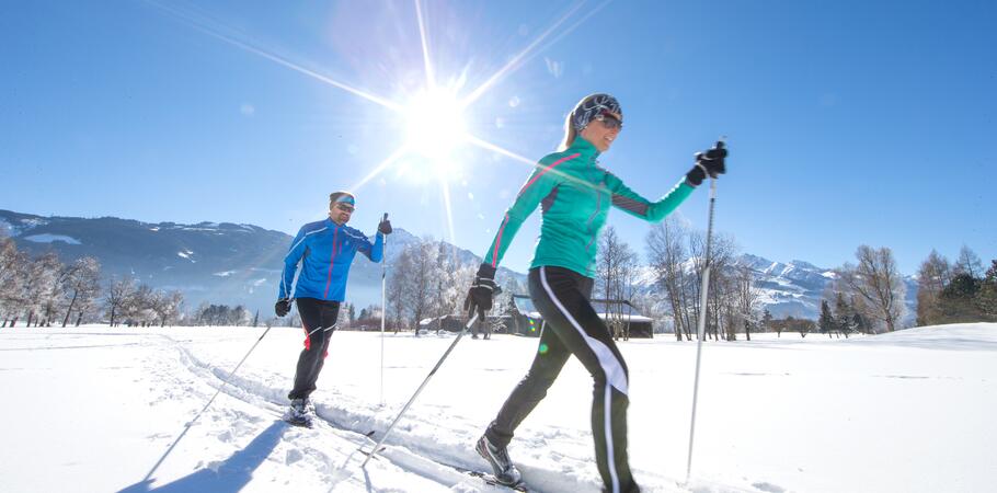 couple cross-country-skiing active holiday salzburger land